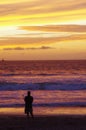 Man on beach enjoying sunset