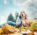 Man with beagle on autumn view landscape Royalty Free Stock Photo