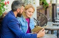 Man with beard and blonde woman cuddle on romantic date. Romance concept. Love and flirt. Couple flirting romantic date