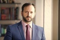 Man with beard in blue jacket, shirt and tie Royalty Free Stock Photo