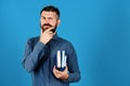 Man with beard and books. Notebooks in blue color Royalty Free Stock Photo