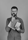 Man with beard and books. Notebooks in blue color Royalty Free Stock Photo