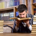 Man with beard in classic suit, scientist or professor sniffs Royalty Free Stock Photo