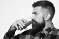 Man with beard drinks tomato juice on white background