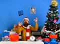 Man with beard and excited face celebrates Boxing Day.