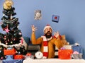 Man with beard and excited face celebrates Boxing Day.