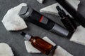 Man beard grooming items on a stone table surface, comb, oil and electric trimmer Royalty Free Stock Photo