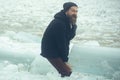 Man with beard hold big ice. Winter holiday and activity. Power and strength of man with frozen hummock. Cracked ice