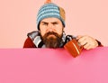 Man with beard holds brown cup of curing powder. Royalty Free Stock Photo