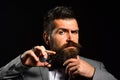 Man with beard holds steel scissors. Businessman with serious face Royalty Free Stock Photo