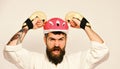 Man with beard in kimono and pink helmet on white Royalty Free Stock Photo