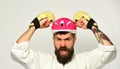 Man with beard in kimono and pink helmet on white Royalty Free Stock Photo