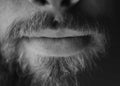 Man, beard and lips closeup with a face in monochrome for creativity and art with facial hair. Black and white, serious