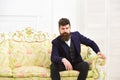 Man with beard and mustache wearing classic suit, stylish fashionable outfit. Macho attractive and elegant on serious Royalty Free Stock Photo