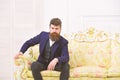 Man with beard and mustache wearing classic suit, stylish fashionable outfit. Macho attractive and elegant on serious Royalty Free Stock Photo