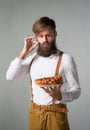 Man with a beard with a pie Royalty Free Stock Photo