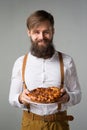 Man with a beard with a pie Royalty Free Stock Photo