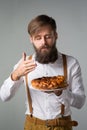 Man with a beard with a pie Royalty Free Stock Photo