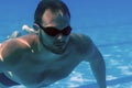 Man with Beard Underwater swimming pool Young beard man with glasses Underwater Royalty Free Stock Photo