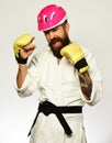 Man with beard in white kimono and pink helmet Royalty Free Stock Photo