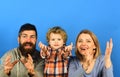 Man with beard, woman and boy play on blue background Royalty Free Stock Photo