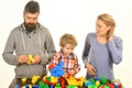 Man with beard, woman and boy play on white background.