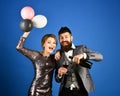 Man with beard and woman in dress on blue background