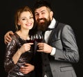 Man with beard and woman in shining dress celebrate