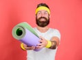 Man bearded athlete hold fitness mat red background. Athlete coach ready for training. Old school aerobics concept. Join