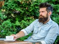 Man bearded businessman sit terrace with laptop and cup of coffee. Freelance benefit. Blogger create post while enjoy