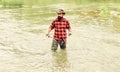 Man bearded fisher. Fishing requires to be mindful and fully present in moment. Fisher fishing equipment. Rest and