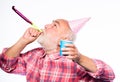 Man bearded grandpa with birthday cap and drink cup. Birthday crazy party. Ideas seniors birthday celebrations