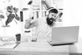 Man bearded guy headphones office swing hammer on computer. Slow internet connection. Outdated software. Computer lag Royalty Free Stock Photo