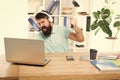 Man bearded guy headphones office swing hammer on computer. Slow internet connection. Outdated software. Computer lag Royalty Free Stock Photo