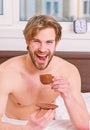 Man bearded handsome macho hold cup of coffee. Best time to have your cup of coffee. Guy attractive appearance man enjoy