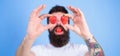 Man bearded happy love enjoy juicy red ripe strawberry. Sweet temptation. Berries sweet happiness. Hipster with beard Royalty Free Stock Photo