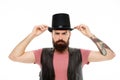 Man bearded hipster cylinder hat. Illusionist performance concept. Magician sorcerer genie performance. Circus worker Royalty Free Stock Photo