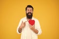 Man bearded hipster hold red heart. Prescribe medication lower blood pressure cholesterol. Feel pulse check heart rate