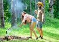 Man bearded hipster looks at female buttocks. Seductive position. Girl buttocks denim shorts roasting sausage Royalty Free Stock Photo