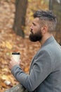 Man bearded hipster prefer coffee take away. Businessman bearded guy drink coffee outdoors. Hipster hold paper coffee Royalty Free Stock Photo