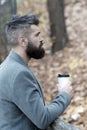 Man bearded hipster prefer coffee take away. Businessman bearded guy drink coffee outdoors. Hipster hold paper coffee Royalty Free Stock Photo