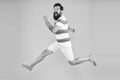 Man bearded hipster run yellow wall. Guy beard striped shirt. Freedom jump. Sale and discount. rush hour. lets go