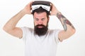 Man bearded hipster with virtual reality headset on white background isolated. Sensational feelings of using VR headset