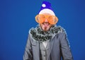 Man bearded hipster wear santa hat and funny sunglasses. Manager tinsel ready celebrate new year. Christmas party office Royalty Free Stock Photo