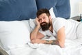 Man bearded hipster woke up too early and feels sleepy and tired. Early to get up. Keep you wide awake in the early Royalty Free Stock Photo