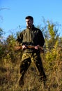 Man bearded hunter rifle nature background. Hunting hobby concept. Hunting season. Experience and practice lends success