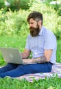 Man bearded with laptop nature background. Blogger create content for social network. Writer or blogger write post for