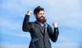 Man bearded optimistic businessman wear formal suit sky background. Success and luck. Optimistic mood. Think like