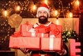 Man bearded santa celebrate christmas with presents. May your home be filled with all joys of season. New year Royalty Free Stock Photo