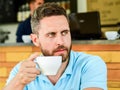 Man bearded serious face needs energy charge. Traditional coffee break cafe background. Caffeine makes you more Royalty Free Stock Photo